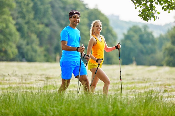 Couple doing Nordic walking, great for bone health.